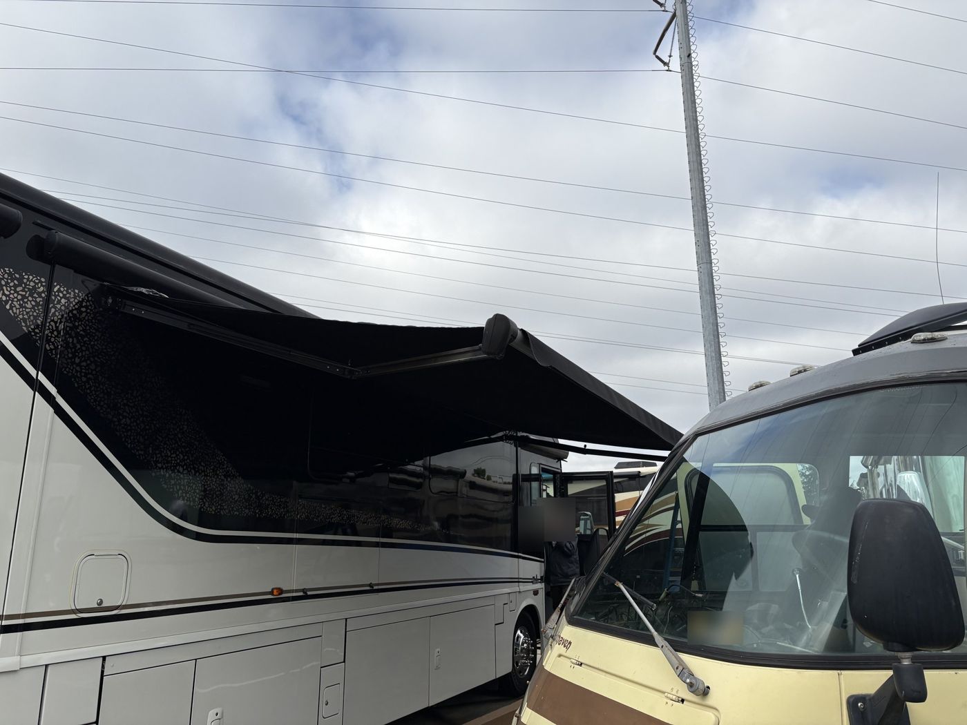 Long patio awning extended on a Winnebago Horizon motorhome